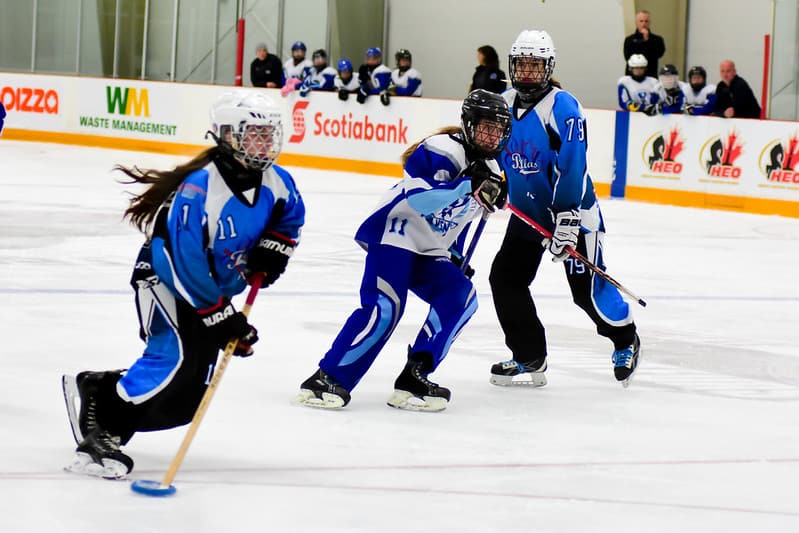 Girl Showing How To Play Ringette